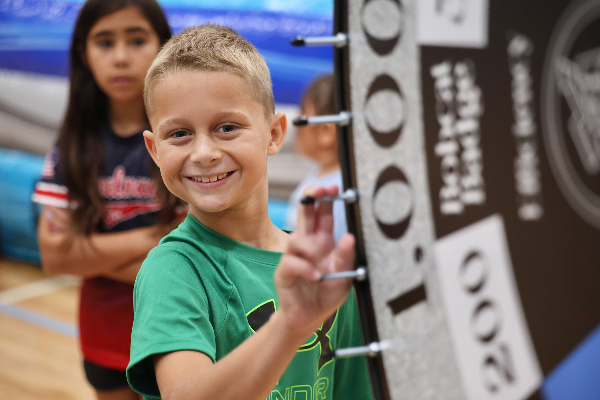 student spinning the wheel - <p>Our students had an amazing time being sorted into houses the first week of school!</p>