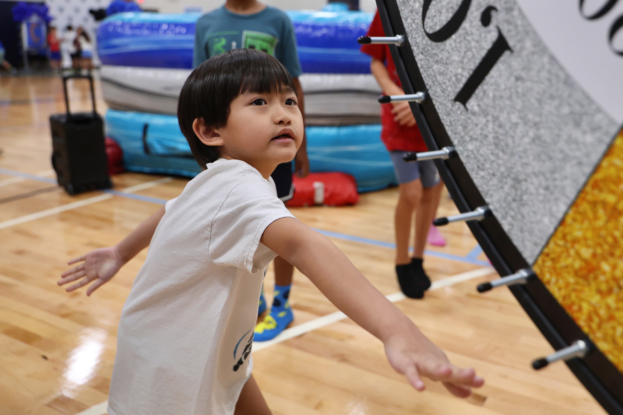 student spinning the wheel - <p>Our students had an amazing time being sorted into houses the first week of school!</p>